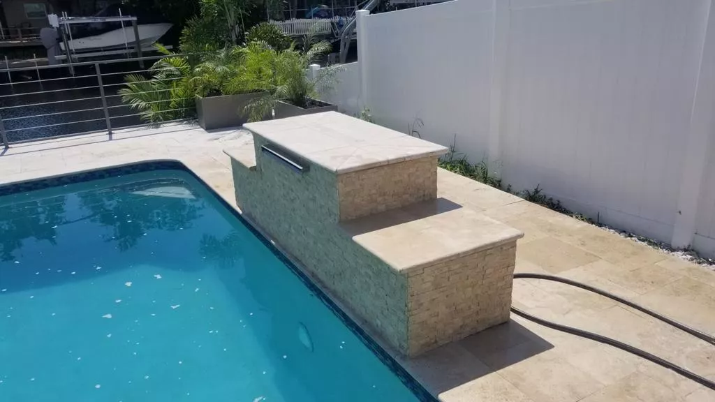 Cool down in style with a custom pool waterfall.