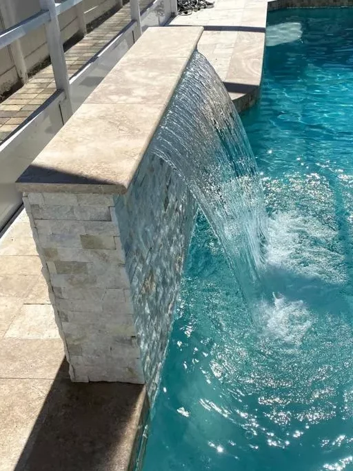 Cool down in style with a custom pool waterfall.